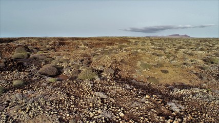 Walking through volcanic lava and contemplating the landscape