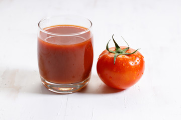 fresh tomatoes on white wooden background