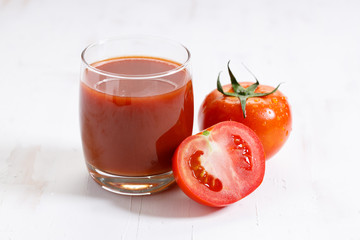 fresh tomatoes on white wooden background