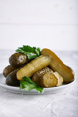 pickled cucumbers with herbs and onions in a plate on the table Probiotics food
