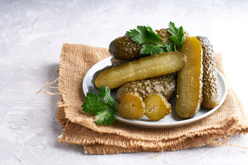 pickled cucumbers with herbs and onions in a plate on the table Probiotics food