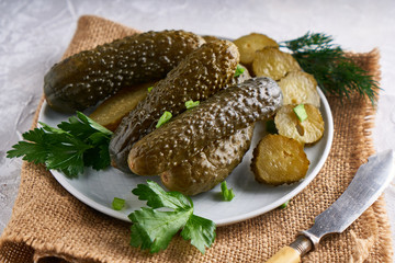 pickled cucumbers with herbs and onions in a plate on the table Probiotics food