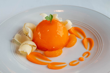  orange dome cake on white plate