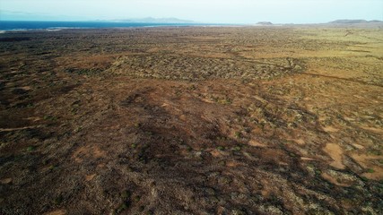 Walking through volcanic lava and contemplating the landscape