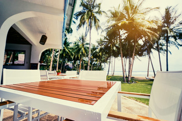 Table in resort cafe on the tropical sea beach with beautiful view.