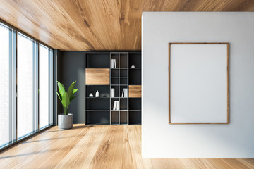 Gray living room with bookcase and poster