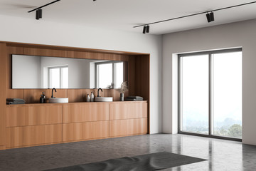 Wood and white bathroom corner with double sink