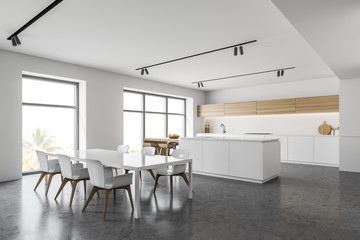 White kitchen corner with table and bar