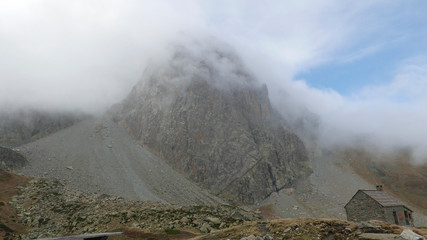 Midi d´ossau with clouds and refuge