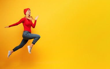 Obraz premium Girl runs fast. concept of energy and vitality.yellow background