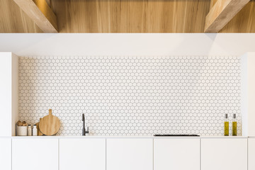 Countertops in hexagonal tile wall kitchen