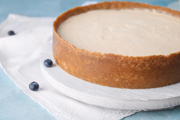 Sweet tasty cheesecake on table