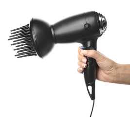 Female hand with modern hair dryer on white background