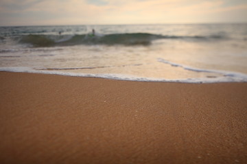 foam on sandy tropical ocean beach