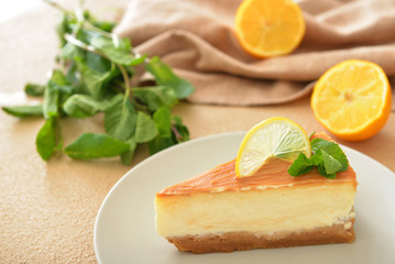 Slice of sweet caramel cheesecake on plate