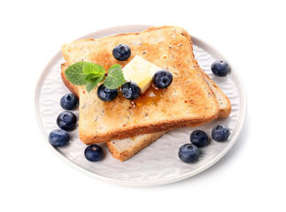 Tasty toasted bread with honey, butter and berries on white background