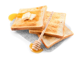 Tasty toasted bread with honey and butter on white background