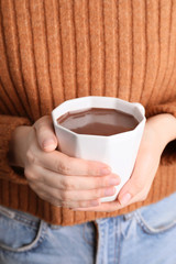 Woman with cup of hot chocolate, closeup