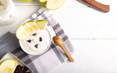 organic yogurt with chocolate and fresh apple