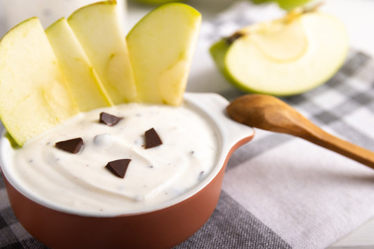 organic yogurt with chocolate and fresh apple