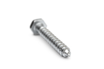 Metal hex screw on white background.