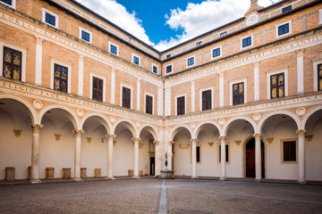 Fototapeta na wymiar URBINO - ITALY – : Courtyard of Palazzo Ducale (Ducal Palace), now a museum, in Urbino. Marche region, Italy.