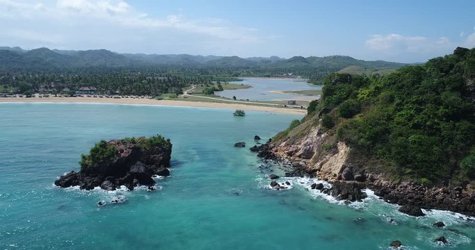 The south coast beaches of the island of Lombok, Indonesia from the sky. Aerial view over the shoreline of Indonesian islands. a birds eye view captured with a drone