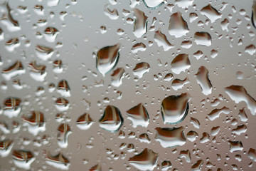 Macro raindrops on a window in Marbella, Spain