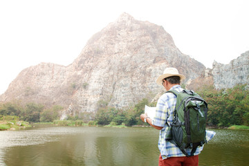 Senior man backpacking hiking Nature travel He is healthy. The concept of a happy life after retirement . Copy space