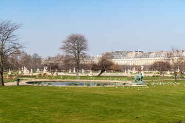 Jardin des Tuileries in Paris: View of a small pond in the empty garden in winter