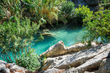 Waterfall with green water pond, Las Fuentes del Algar, Alicante, Spain