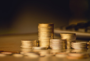 stacks of gold money coin background concept saving money with vintage filter