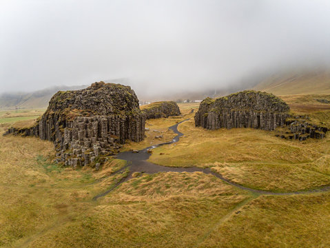 Dverghamrar dwarf hammer natural basalt columns covered in grass and moss landscape in Iceland