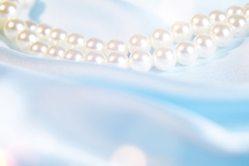 Wedding background. Satin with pearls