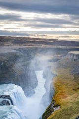Gullfoss waterfall in Iceland deep canyon cut in landscape by the water