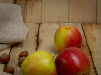Natural apples from the garden in a wooden background