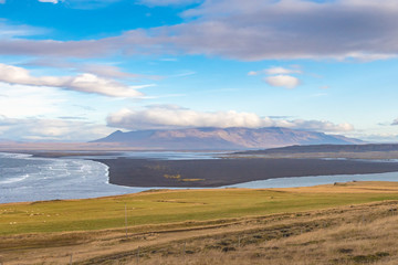 Hvitserkur rock formation in Iceland bay next to sight with black beaches