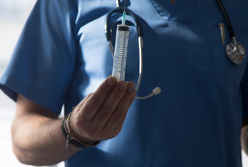 doctor with stethoscope and syringe, medicine and infections concept