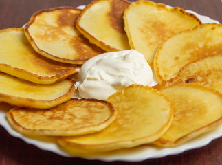 Homemade fritters with sour cream