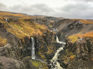 Litlanesfoss and Hengifoss waterfall in east Iceland during rainy weather
