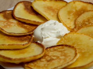 Homemade fritters with sour cream