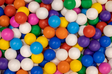 Fototapeta na wymiar texture of multi-colored plastic balls for the background. For children`s rooms, playgrounds. close-up, top view
