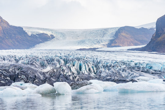 Vatnajoekull glacier in Iceland deep blue ice and layers of ash from volcanic eruptions