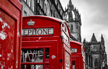 red telephone box in edimburgh scotland in black and with with red in contrast