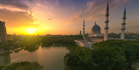 Fototapeta na wymiar super panorama sunset view aerial shot with mosque and lake in the frame