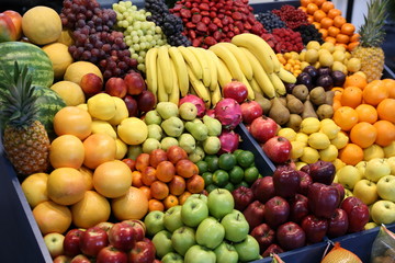 Naklejka na ściany i meble Various fresh summer exotic fruits for sale on market