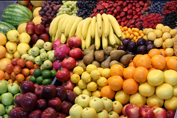 Naklejka na ściany i meble Various fresh summer exotic fruits for sale on market