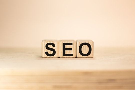 Seo word from wooden blocks on desk, search engine optimization concept