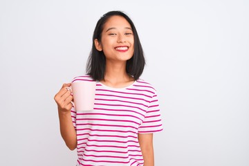 Young beautiful chinese woman drinking cup of coffee over isolated white background with a happy face standing and smiling with a confident smile showing teeth
