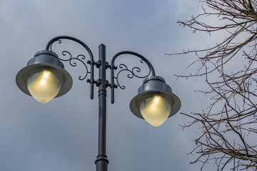 Vintage black iron lantern on a city street